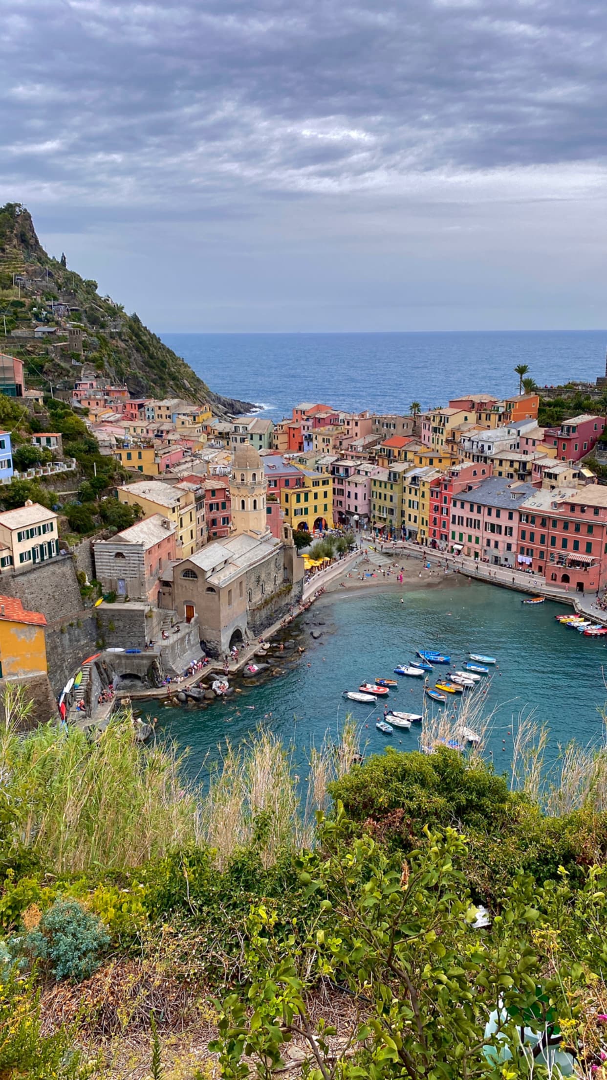 Beautiful view of Vernazza, Italy with colorful buildings around water