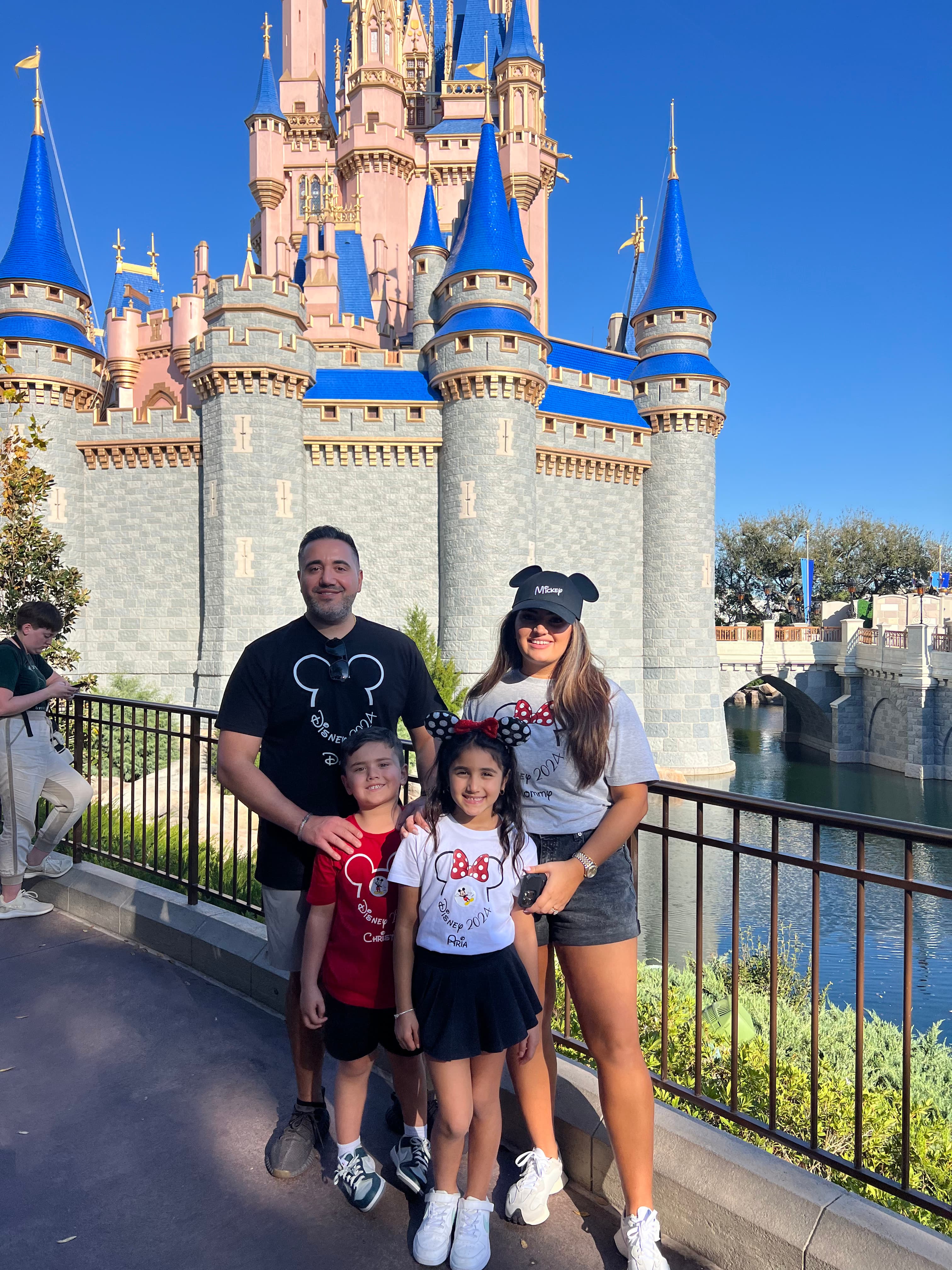 Posing for a family photo in Disney land
