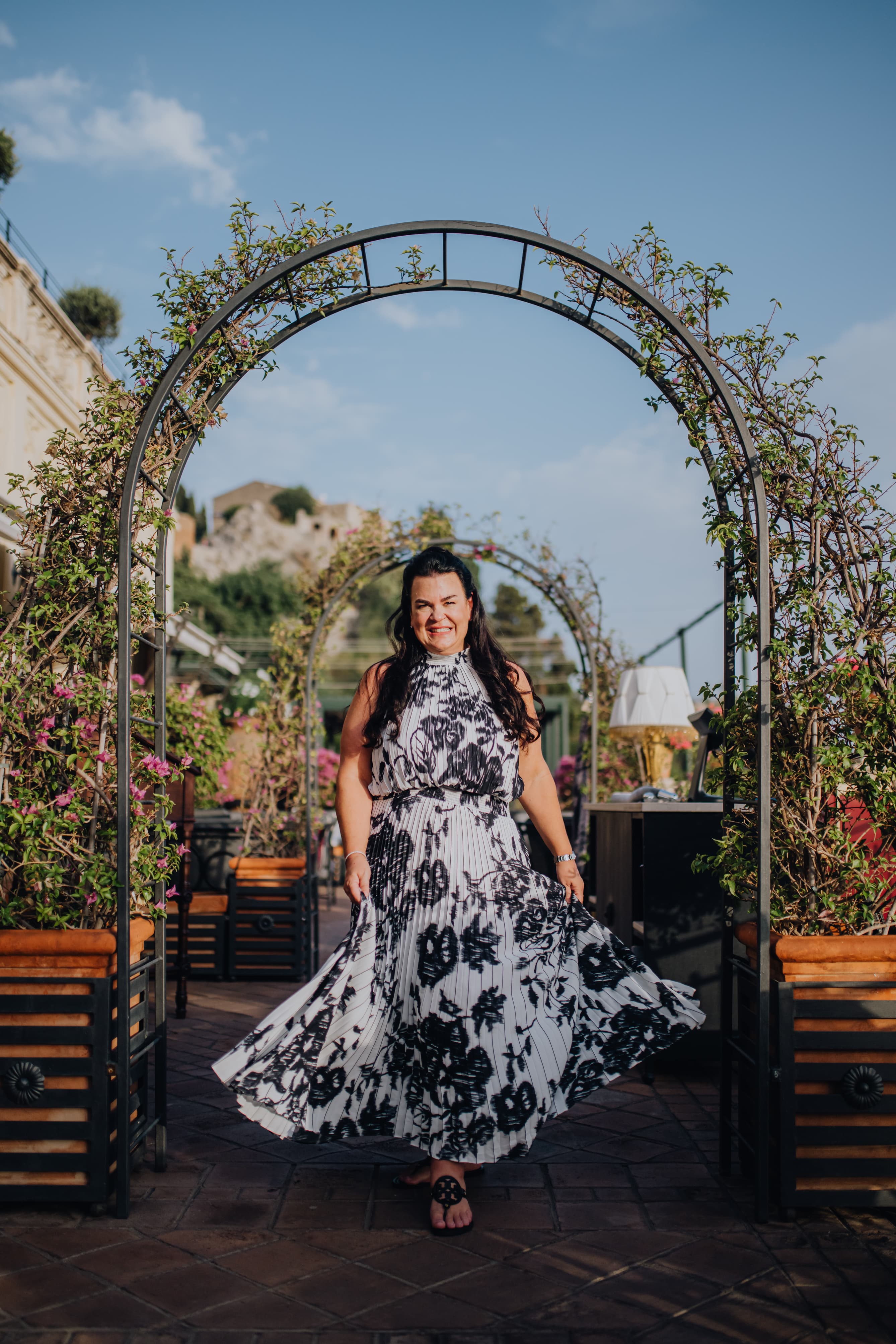 Posing for a photo under an arch