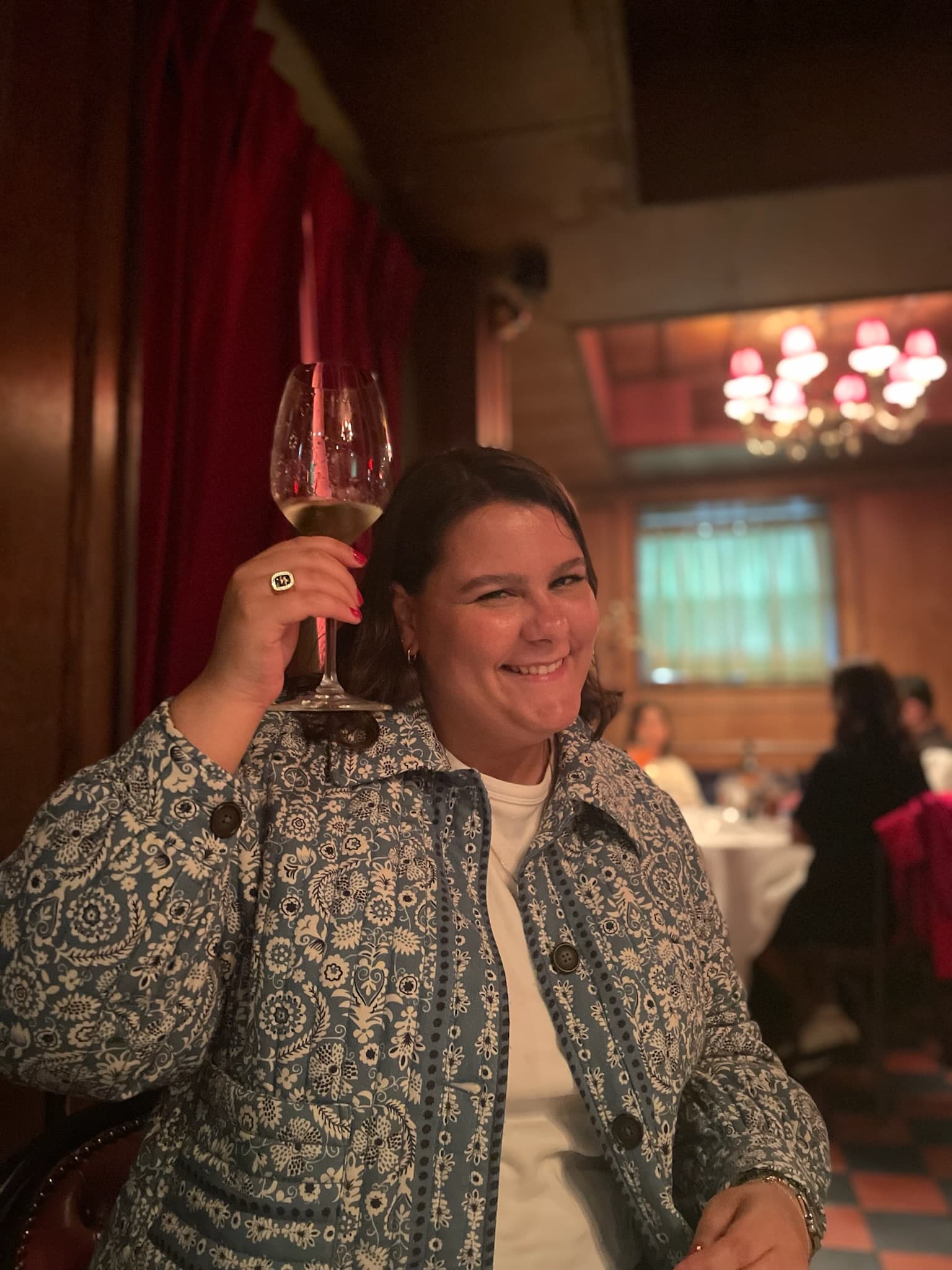 Raising a glass of wine