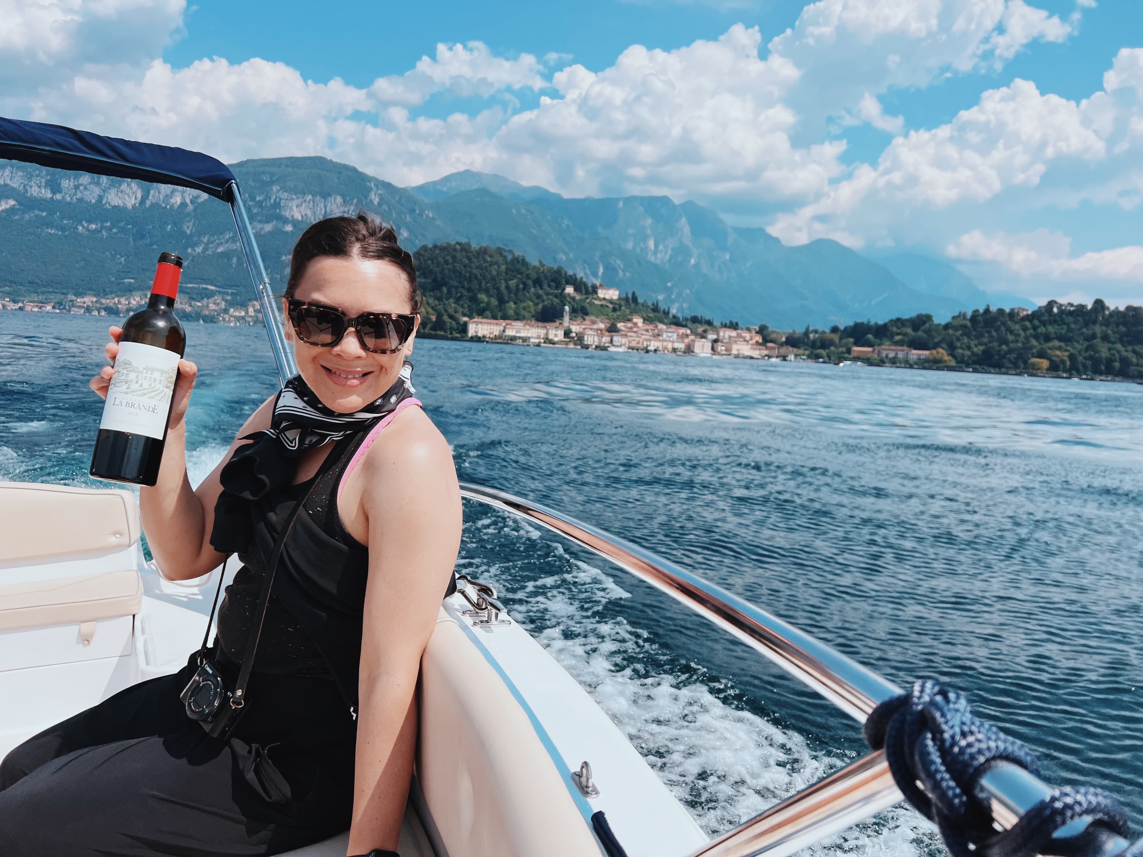 Picture of Michelle with wine bottle in hand on yacht